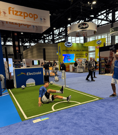 Electrolit soccer-themed exhibit at NACS 2025